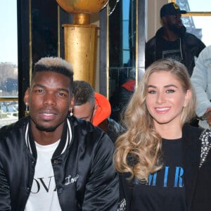 Paul Pogba et sa femme Maria au défilé Amiri lors de la Fashion Week Homme de Paris, automne/hiver 2020-2021 le 16 janvier 2020.