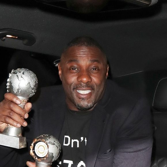Idris Elba et sa compagne Sabrina Dhowre à la sortie de la soirée des "National Film Awards 2019" à Londres, le 27 mars 2019.