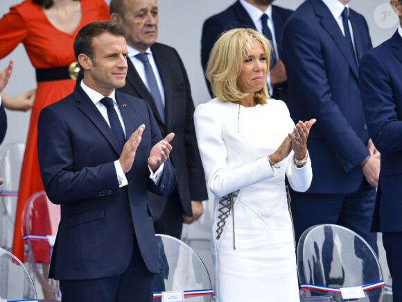 Emmanuel Macron, président de la République Française, et la Première dame Brigitte Macron lors du 139ème défilé militaire du 14 juillet sur les Champs-Elysées, jour de la Fête Nationale. Paris, le 14 juillet 2019. © Lemouton-Gorassini-Perusseau/Bestimage