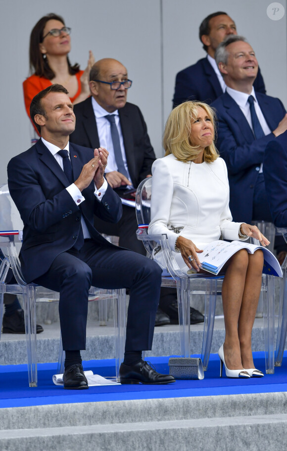 Emmanuel Macron, président de la République Française, et la Première dame Brigitte Macron lors du 139ème défilé militaire du 14 juillet sur les Champs-Elysées, jour de la Fête Nationale. Paris, le 14 juillet 2019. © Lemouton-Gorassini-Perusseau/Bestimage