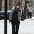 Exclusif - Cyril Hanouna se promène à vélo ( un vélo électrique de la marque Moov Way) et avec un masque de protection dans les rues de Paris pendant l'épidémie de Coronavirus Covid-19 le 20 mai 2020.
