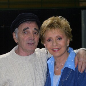 Archives - Charles Aznavour et Annie Cordy sur le tournage du film "Passage du bac" en 2001  