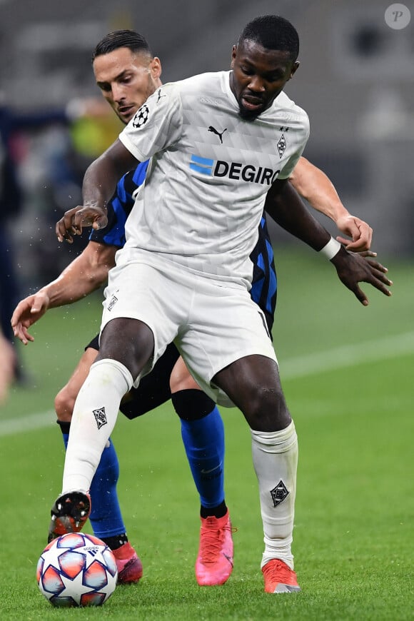 Marcus Thuram-Danilo D'Ambrosio - Match nul entre Milan et Borussia Mönchengladbach (2 - 2) en Ligue des Champions à Milan, le 22 octobre 2020. <br /><br />