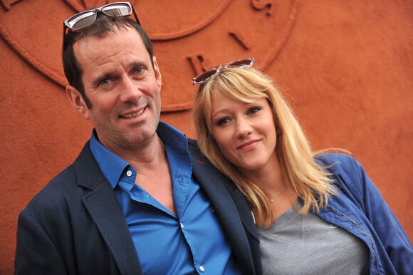 Christian Vadim et sa femme Julia Livage posant au village des Internationaux de France de tennis de Roland Garros à Paris, le 3 juin 2014.