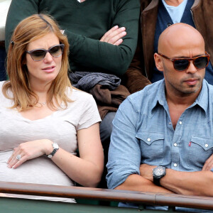 Eric Judor et sa nouvelle compagne enceinte aux Internationaux de France de tennis de Roland Garros à Paris, le 29 mai 2014.