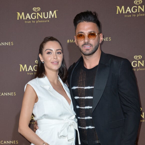 Nabilla Benattia (enceinte) et son mari Thomas Vergara au photocall de l'after party "Magnum x Rita Ora" sur la plage privée Magnum lors du 72ème Festival International du Film de Cannes, France,le 16 mai 2019. © Veeren/Bestimage