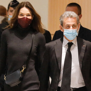 1er jour des plaidoiries de la défense - Nicolas Sarkozy arrive avec sa femme Carla Bruni Sarkozy procès des "écoutes téléphoniques" (affaire Bismuth) au tribunal de Paris.. © Christophe Clovis / Bestimage 