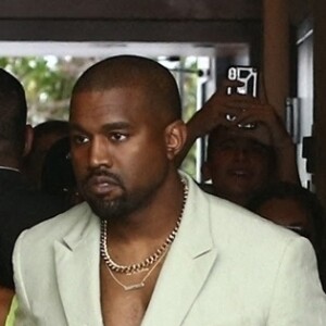 Kim Kardashian and Kanye West show off her unique wedding guest looks as they are seen outside of the Versace Mansion for a private wedding august 18, 2018.