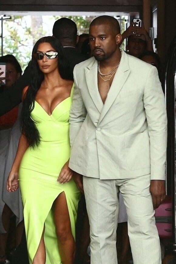 Kim Kardashian and Kanye West show off her unique wedding guest looks as they are seen outside of the Versace Mansion for a private wedding august 18, 2018.