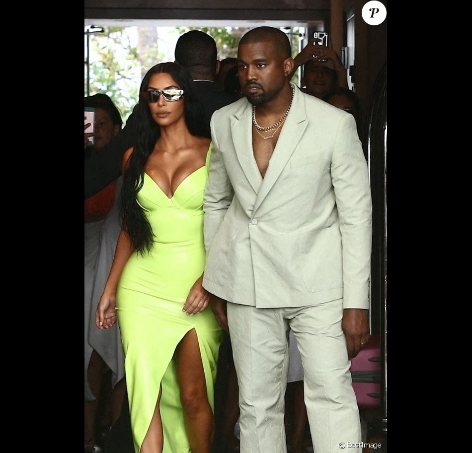 Kim Kardashian and Kanye West show off her unique wedding guest looks as they are seen outside of the Versace Mansion for a private wedding august 18, 2018.