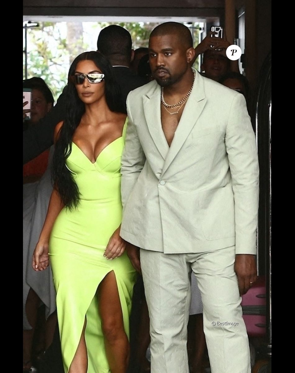 Kim Kardashian and Kanye West show off her unique wedding guest looks as they are seen outside of the Versace Mansion for a private wedding august 18, 2018.