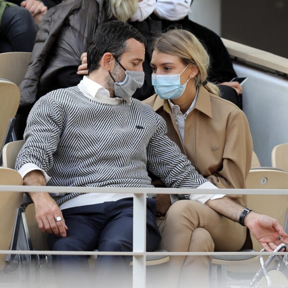 Michaël Cohen et sa compagne dans les tribunes du tournoi de tennis des Internationaux de Roland Garros à Paris. Le 7 octobre 2020 © Dominique Jacovides / Bestimage