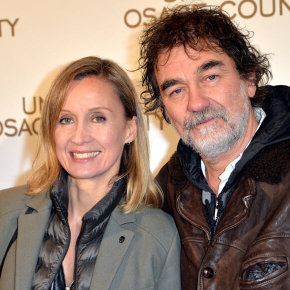 Olivier Marchal et sa femme Catherine - Avant-première du film "Un été à Osage County" à l'UGC Normandie à Paris.