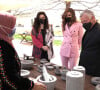 Le roi Abdullah de Jordanie et la reine Rania visitent le marché de rue du programme Productive Youth Initiative, à Amman, le 30 mars 2021. 