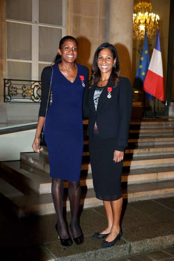 Marie-José Pérec et Christine Arron à la remise de décorations aux personnalités sportives par le Président de la République, Francois Hollande, au Palais de l'Élysée. Paris, le 9 octobre 2013.