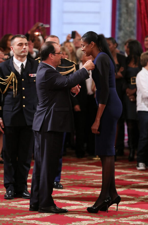 Marie-José Pérec et Christine Arron à la remise de décorations aux personnalités sportives par le Président de la République, Francois Hollande, au Palais de l'Élysée. Paris, le 9 octobre 2013.