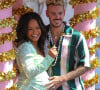 Christina Milian, enceinte, et son compagnon M Pokora (Matt) font la promotion de la marque "Beignet Box" de Christina sur un char lors d'une parade à Los Angeles