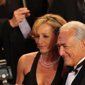 Dominique Strauss Kahn et sa compagne Myriam L'Aouffir sur le tapis rouge lors du 66eme festival du film de Cannes. Le 25 mai 2013 