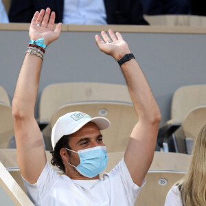 Amir Haddad et sa femme Lital dans les tribunes des Internationaux de France de Tennis de Roland Garros à Paris. Le 9 juin 2021 © Dominique Jacovides / Bestimage