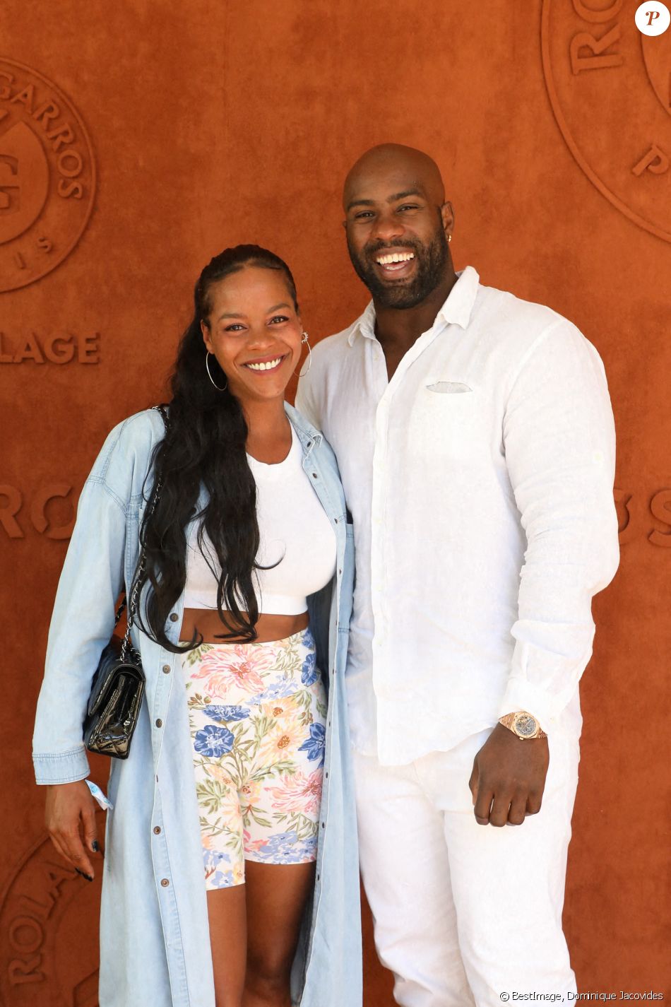 Teddy Riner et sa femme Luthna Plocus au village de Roland-Garros avant la finale opposant Novak Djokovic à Stefanos Tsitsipas. Paris, le 13 juin 2021. © Dominique Jacovides / Bestimage