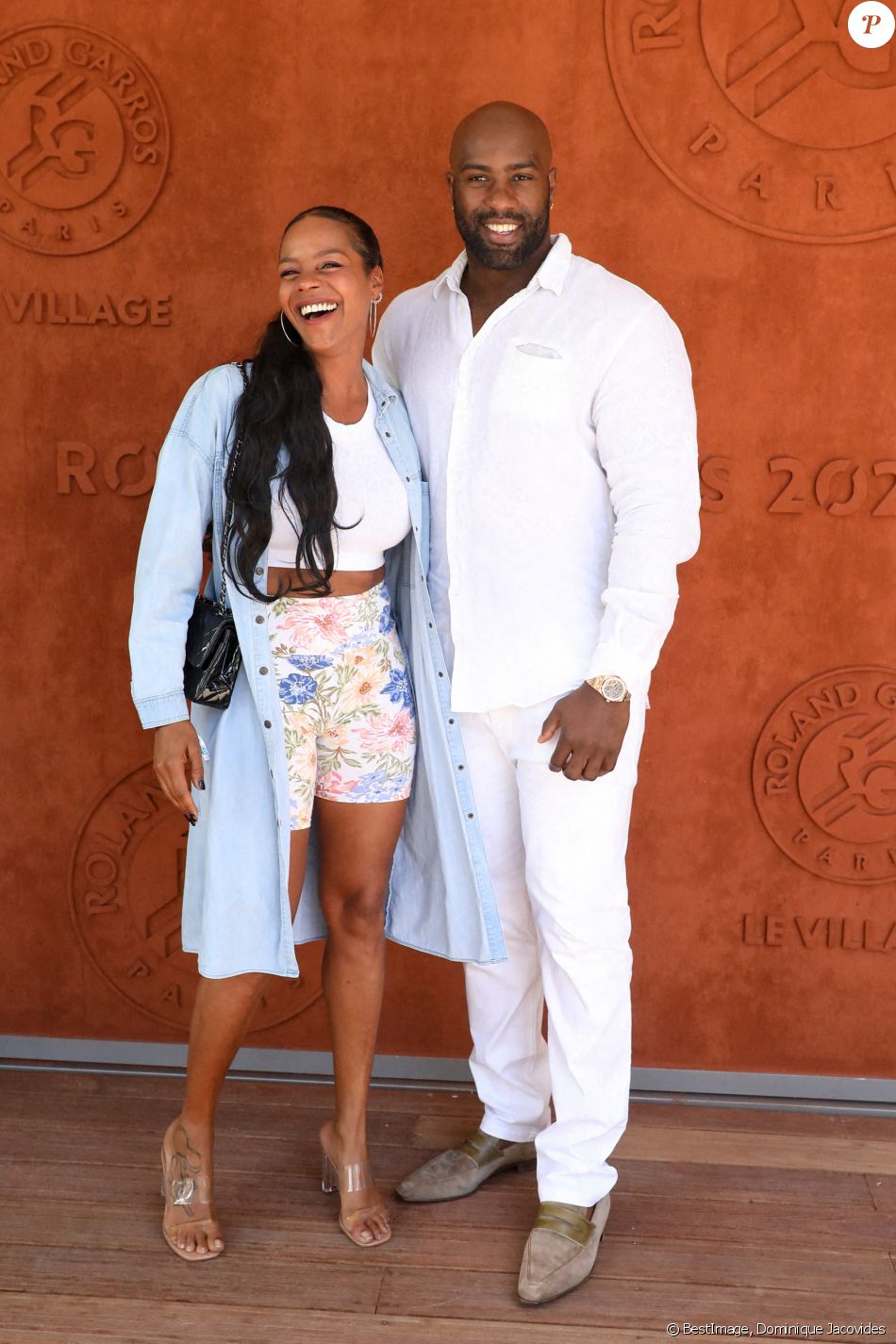 Teddy Riner et sa femme Luthna Plocus au village de Roland-Garros avant la finale opposant Novak Djokovic à Stefanos Tsitsipas. Paris, le 13 juin 2021. © Dominique Jacovides / Bestimage