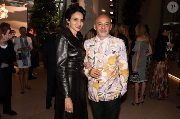 Farida Khelfa et Christian Louboutin au dîner de lancement des Parfums Louis Vuitton ("Stellar Times", "Cosmetic Cloud", "Dancing Blossom", "Rhapsody" et "Symphony") à la Fondation Louis Vuitton. Paris, France, le 5 juillet 2021.