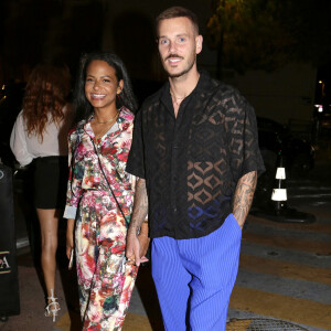 M. Pokora et Christina Milian quittent le VIP Room (et le restaurant La Gioia) à Saint-Tropez, dans la nuit du 9 au 10 juillet 2021.