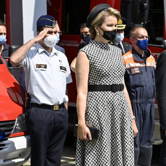 Le roi Philippe et la reine Mathilde de Belgique rendent hommage aux victimes des inondations à Verviers, le 20 juillet 2021, lors de la journée de de deuil national en Belgique.