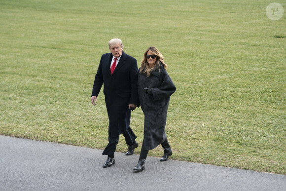 Le président Donald Trump et sa femme Melania arrivent à la Maison Blanche après leur séjour en Floride. Le 31 décembre 2020.