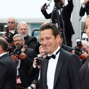 Laurent Gerra et sa compagne Christelle Lyon (Bardet) - Montée des marches du film "La Glace et le Ciel" lors du 68e Festival du film de Cannes, le 24 mai 2015.