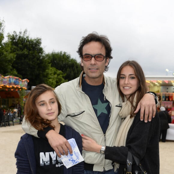 Anthony Delon avec ses filles Liv et Loup - Inauguration de la fete foraine des Tuileries a Paris le 28 juin 2013.