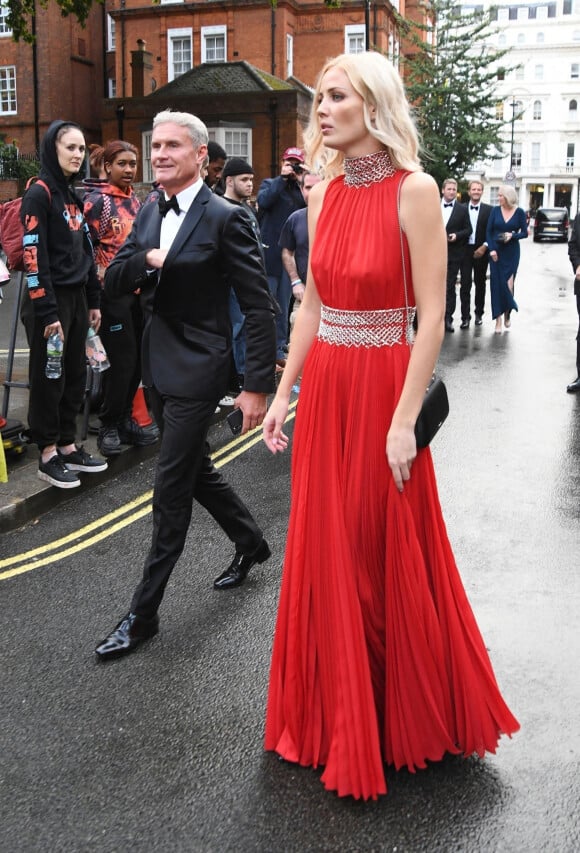 En compagnie de Sigrid Silversand, David Coulthard, l'ancien pilote écossais de Formule 1 de 50 ans, assiste à l'avant-première mondiale du nouvel opus de James Bond "No Time to Die" au Royal Albert Hall à Londres, le 28 septembre 2021.