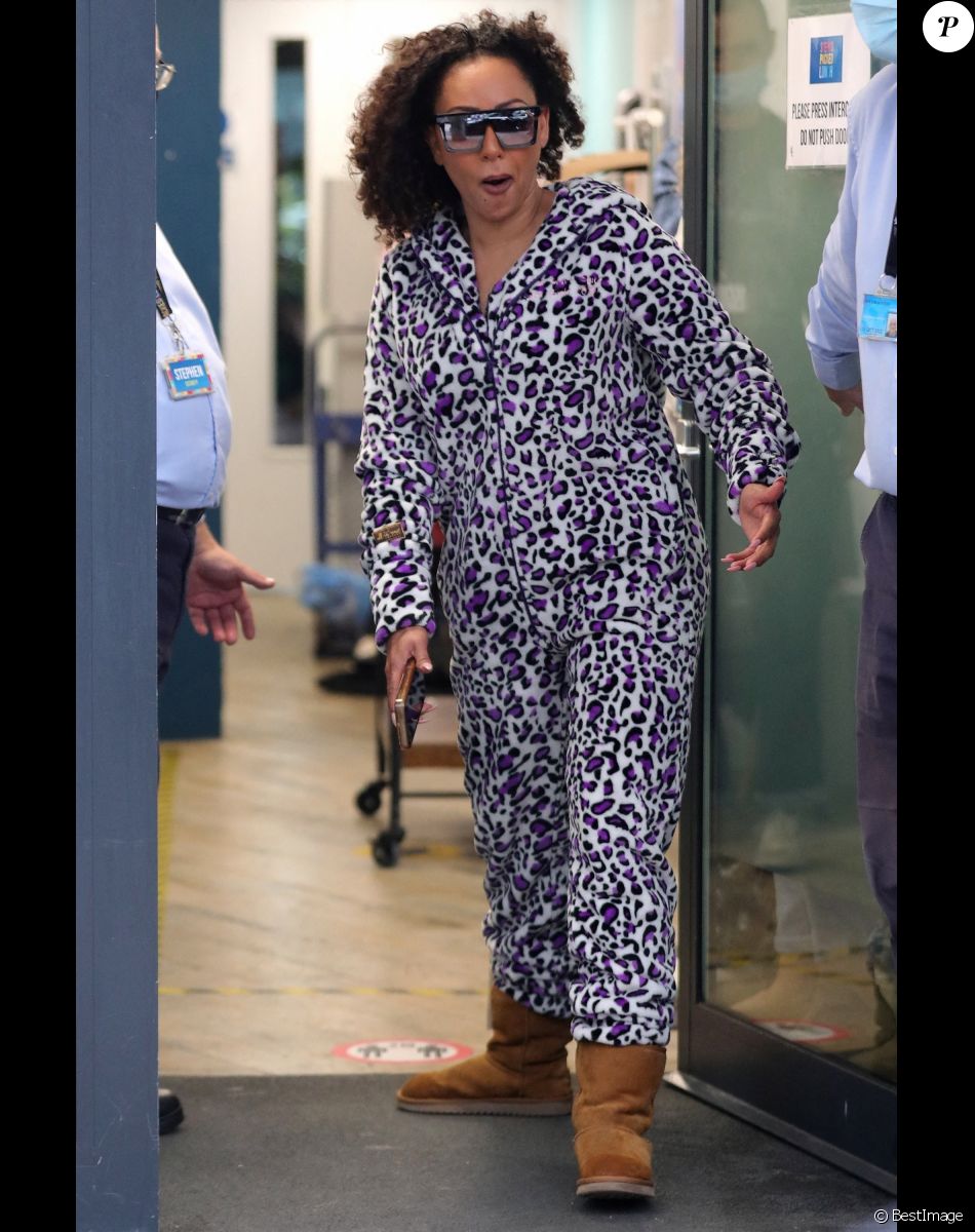 Mel B et son compagnon Rory McPhee quittent les studios de l'émission "Mel B's Packed Lunch" (Channel 4) à Leeds, le 10 septembre 2021.