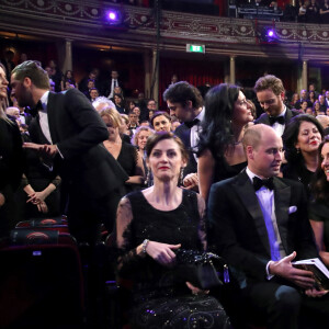 Le prince William et Catherine Kate Middleton la duchesse de Cambridge (enceinte) avec Amanda Berry (directrice déléguée de la BAFTA) lors de la 71ème cérémonie des British Academy Film Awards (BAFTA) au Royal Abert Hall à Londres, le 18 février 2018.