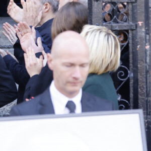 Nathalie Marquay et ses enfants Lou et Tom, guest - La famille de Jean-Pierre Pernaut à la sortie des obsèques en la Basilique Sainte-Clotilde à Paris le 9 mars 2022. © Cyril Moreau/Bestimage