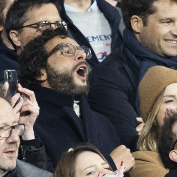 Maxim Nucci (Yodelice) et sa compagne Isabelle Ithurburu assistent à la rencontre de rugby opposant la France à l'Angleterre, au stade de France, dans le cadre du Tournoi des Six Nations. Saint-Denis, le 19 mars 2022. © Cyril Moreau/Bestimage