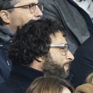 Maxim Nucci (Yodelice) et sa compagne Isabelle Ithurburu assistent à la rencontre de rugby opposant la France à l'Angleterre, au stade de France, dans le cadre du Tournoi des Six Nations. Saint-Denis, le 19 mars 2022. © Cyril Moreau/Bestimage