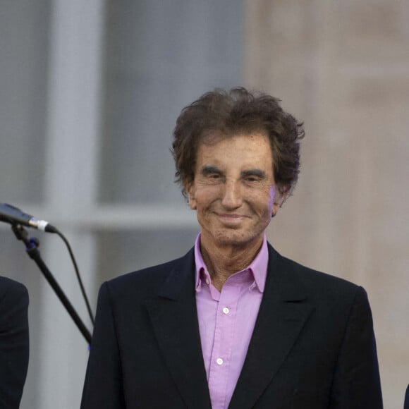 Rima Abdul-Malak, ministre de la Culture, Jack Lang et Emmanuel Macron, président de la République lors de la fête de la musique au palais de l'Elysée à Paris le 21 juin 2022