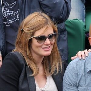 Eric Judor et sa nouvelle compagne enceinte aux Internationaux de France de tennis de Roland Garros à Paris, le 29 mai 2014.