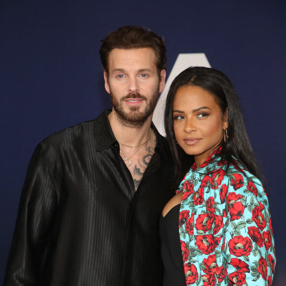 Matt Pokora et sa femme Christina Milian au photocall lors de la première du film "Ambulance" à Los Angeles le 4 avril 2022. 