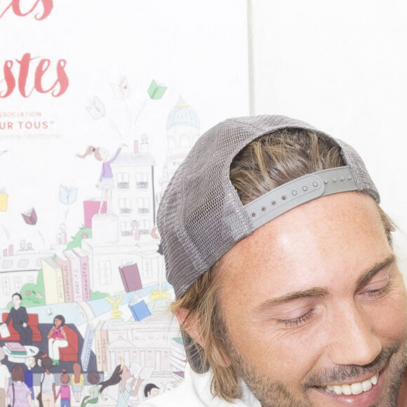 Ghislain Gerin et son mari Christophe Beaugrand - Festival des Livres et des Artistes organisé par l'association "Lecture pour Tous" engagée dans la lutte contre l'illettrisme au Mail Branly à Paris le 2 juillet 2022. © Pierre Perusseau/ Jack Tribeca / Bestimage 