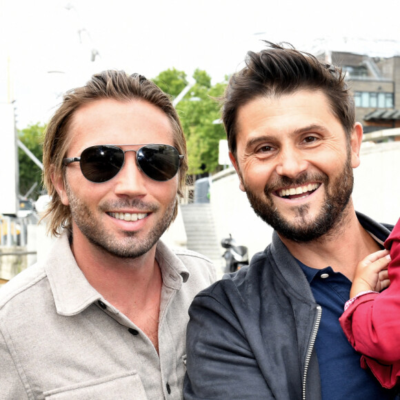 Christophe Beaugrand, son mari Ghislain Gerin et leur fils Valentin - Soirée d'anniversaire des 5 ans de la marque Joone, sur la péniche La Barge à Issy-les-Moulineaux. Paris, le 30 juin 2022 © Veeren / Bestimage