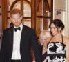 Le prince Harry, duc de Sussex, et Meghan Markle (enceinte), duchesse de Sussex quittent la soirée Royal Variety Performance à Londres le 19 novembre 2018. 
