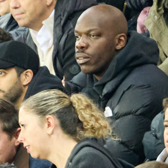 Tarek Boudali et Jean-Pascal Zadi - People au match retour de Ligue Des Champions 2022 (LDC) entre le PSG et Benfica (1-1) au Parc des Princes à Paris le 11 octobre 2022. © Cyril Moreau/Bestimage