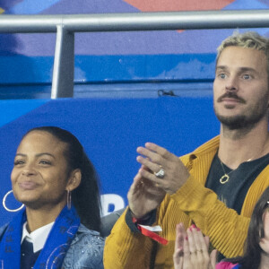 M. Pokora (Matt Pokora), sa femme Christina Milian assistent au match de la 5e et avant-dernière journée de Ligue des nations entre la France et l'Autriche (2-0) au Stade de France à Saint-Denis le 22 septembre 2022.