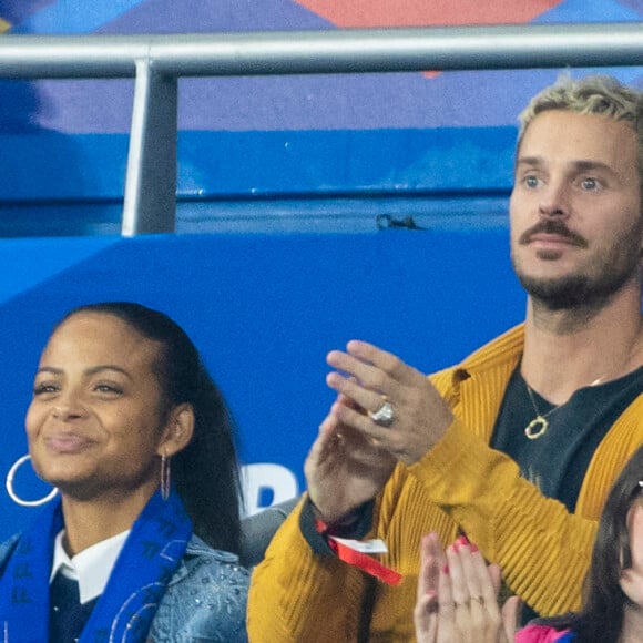 M. Pokora (Matt Pokora), sa femme Christina Milian assistent au match de la 5e et avant-dernière journée de Ligue des nations entre la France et l'Autriche (2-0) au Stade de France à Saint-Denis le 22 septembre 2022.