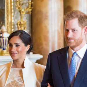 Le prince Harry, duc de Sussex, et Meghan Markle (enceinte), duchesse de Sussex - La famille royale d'Angleterre lors de la réception pour les 50 ans de l'investiture du prince de Galles au palais Buckingham à Londres. Le 5 mars 2019 