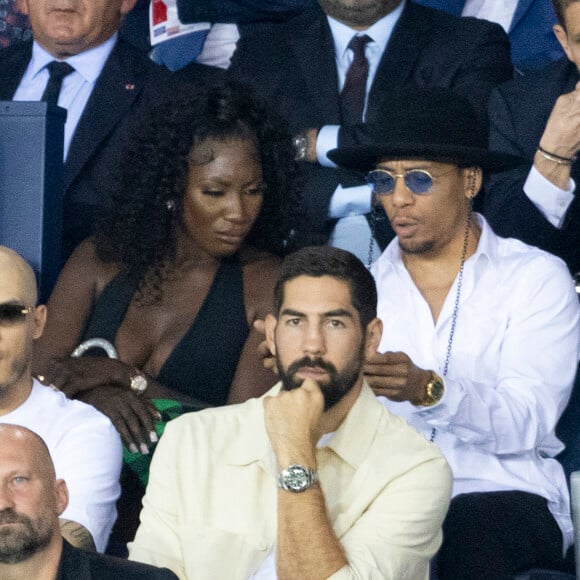 Aya Nakamura, Nikola Karabatic au match aller de la Ligue des Champions entre le Paris Saint-Germain et la Juventus (2-1) au Parc des Princes à Paris le 6 septembre 2022.