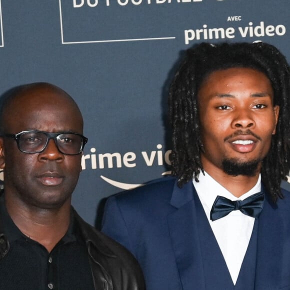 Lilian Thuram et son fils Khephren Thuram - Photocall de la cérémonie des Trophées UNFP 2022 au Pavillon Gabriel à Paris le 15 mai 2022. © Coadic Guirec/Bestimage