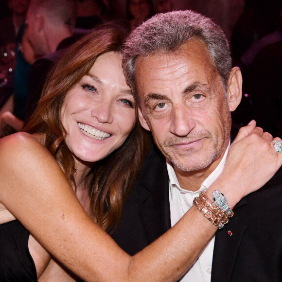 Carla Bruni-Sarkozy et son mari Nicolas Sarkozy - 19e "Diner de la Mode" au bénéfice de Sidaction au Pavillon Cambon Capucines dans le cadre de la Fashion Week de Paris. © Rachid Bellak / Bestimage 